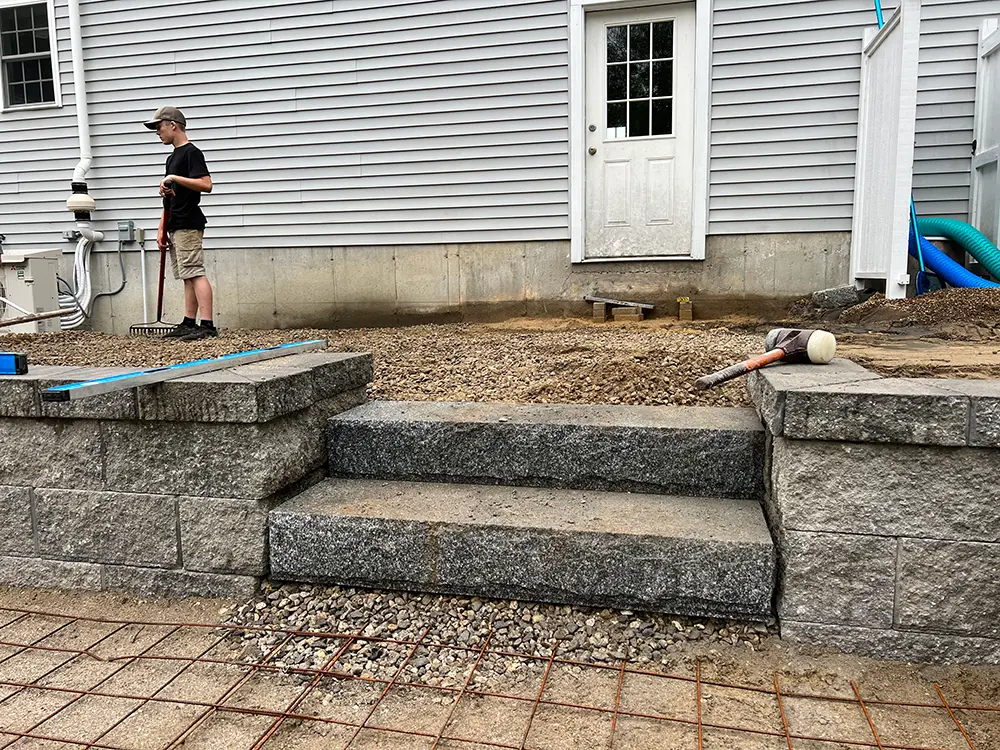 Granite steps set between block retaining walls - J-Pac Construction