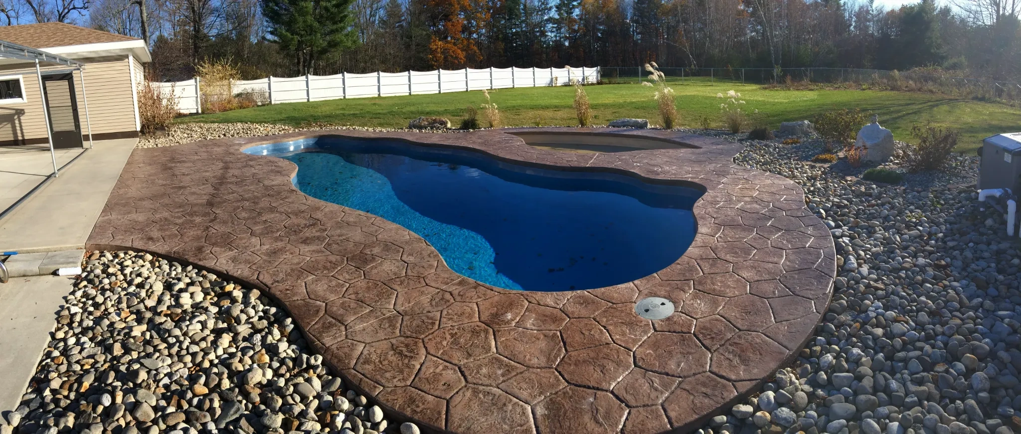Concrete driveway installation by J-PAC Construction.